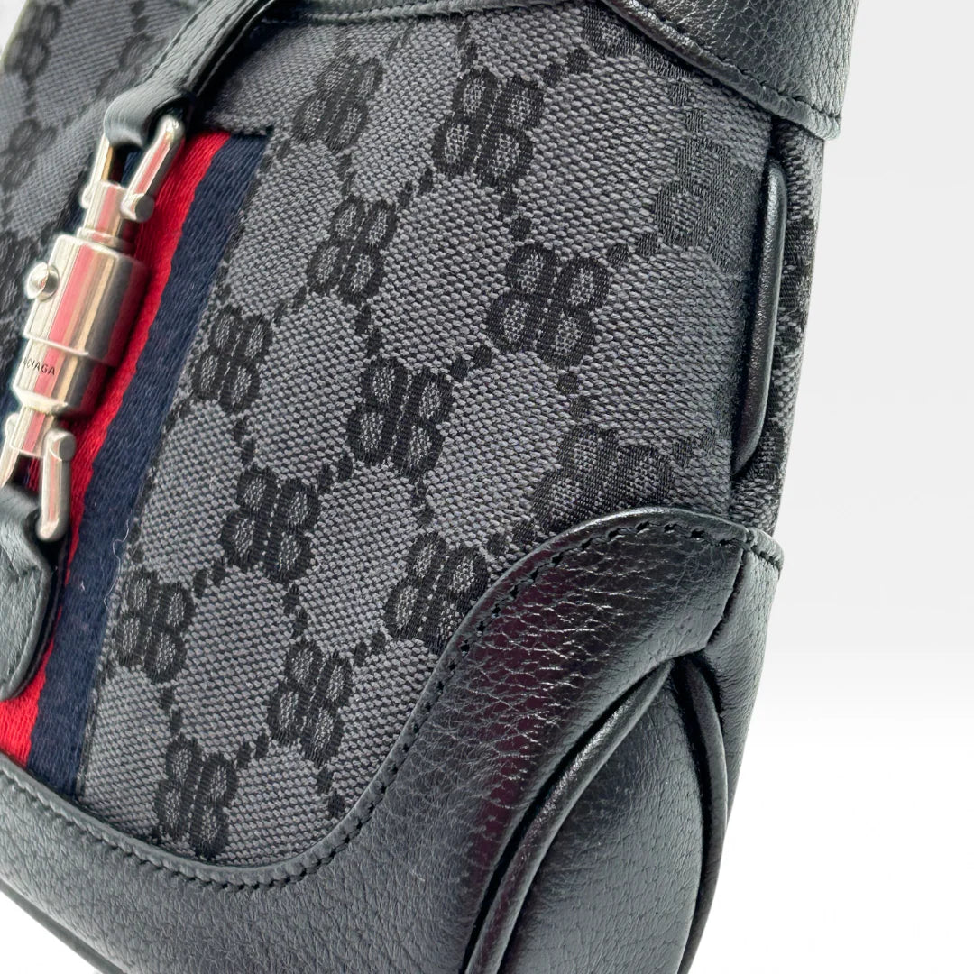 https://cdn.shopify.com/s/files/1/0564/9376/8855/files/Gucci_x_Balenciaga_Handtasche_Jackie_1961_mini_monogram_schwarz_vintage_GG_black_edition_handbag_9956.webp?v=1765456678