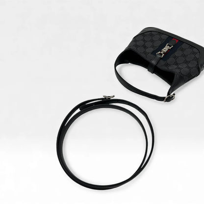 https://cdn.shopify.com/s/files/1/0564/9376/8855/files/Gucci_x_Balenciaga_Handtasche_Jackie_1961_mini_monogram_schwarz_vintage_GG_black_edition_handbag_9958.webp?v=1765456678