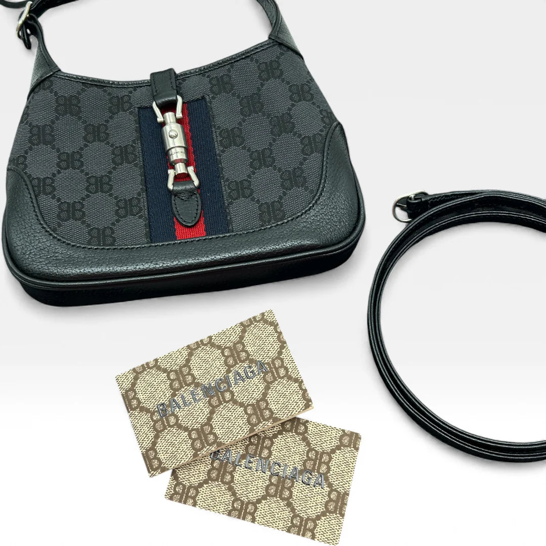 https://cdn.shopify.com/s/files/1/0564/9376/8855/files/Gucci_x_Balenciaga_Handtasche_Jackie_1961_mini_monogram_schwarz_vintage_GG_black_edition_handbag_9969.webp?v=1765456678