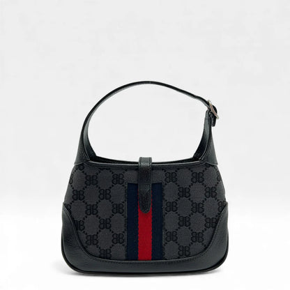 https://cdn.shopify.com/s/files/1/0564/9376/8855/files/Gucci_x_Balenciaga_Handtasche_Jackie_1961_mini_monogram_schwarz_vintage_GG_black_edition_handbag_9971.webp?v=1765456678