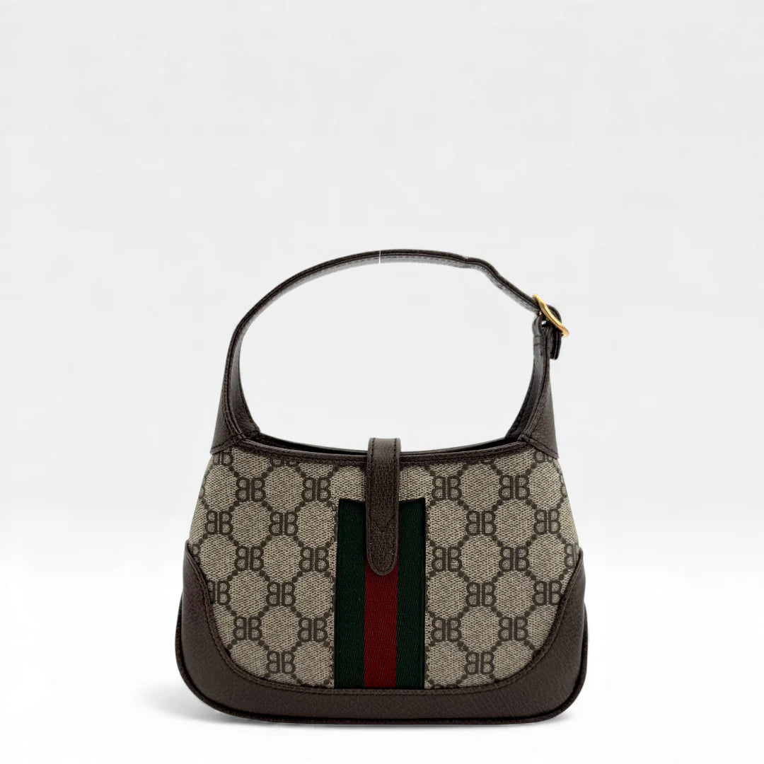 https://cdn.shopify.com/s/files/1/0564/9376/8855/files/Gucci_x_Balenciaga_Handtasche_Jackie_The_Hacker_small_monogram_beige___braun_vintage_GG_handbag_5144.webp?v=1765386248