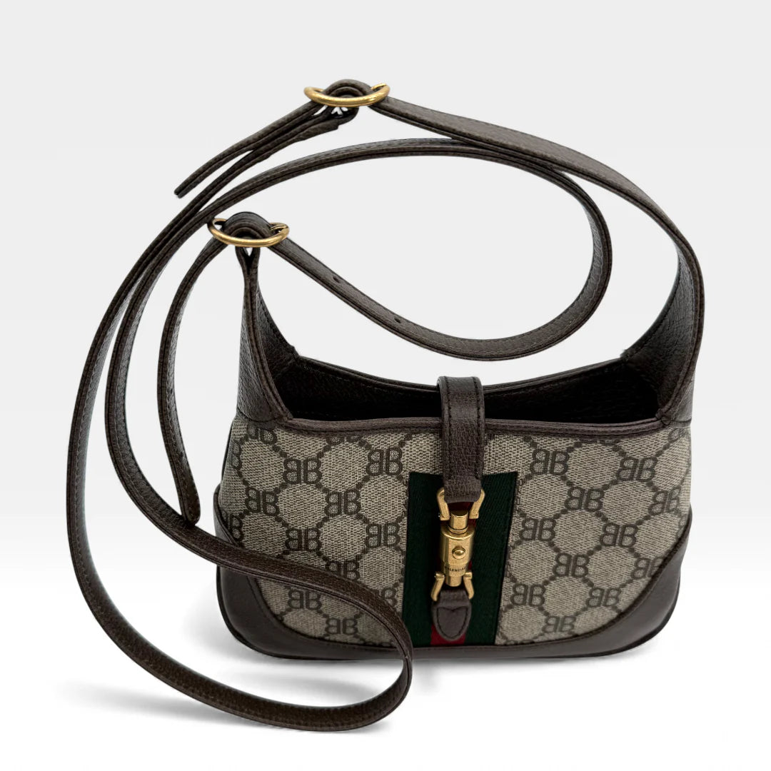 https://cdn.shopify.com/s/files/1/0564/9376/8855/files/Gucci_x_Balenciaga_Handtasche_Jackie_The_Hacker_small_monogram_beige___braun_vintage_GG_handbag_5158.webp?v=1765386248
