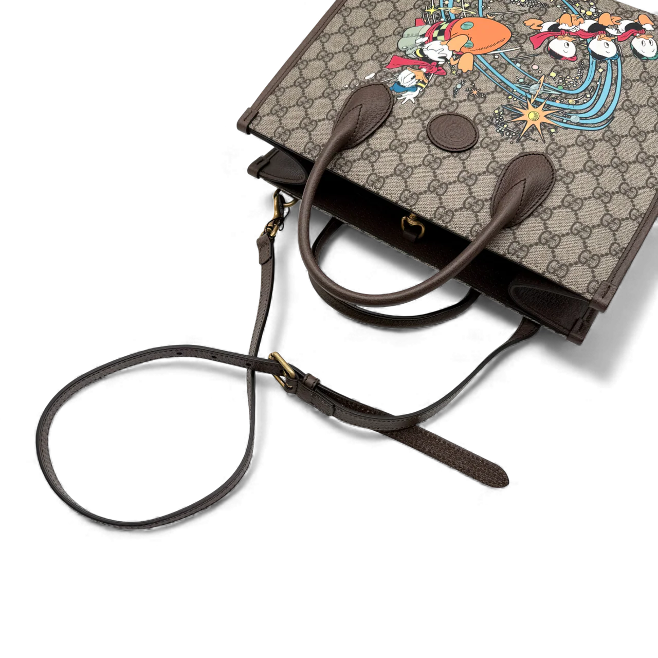 https://cdn.shopify.com/s/files/1/0564/9376/8855/files/Gucci_x_Disney_Handtasche___Tote_Bag_Donald_Duck_Ebony_GG_Supreme_monogram_beige___braun4315.webp?v=1764850487