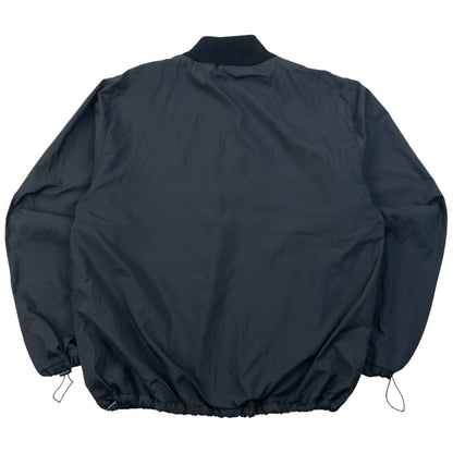 Burberry beige and black reversible jacket featuring classic Nova Check pattern and branded zipper pull.