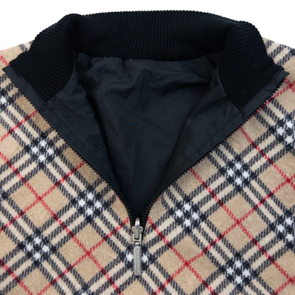Burberry beige and black reversible jacket featuring classic Nova Check pattern and branded zipper pull.