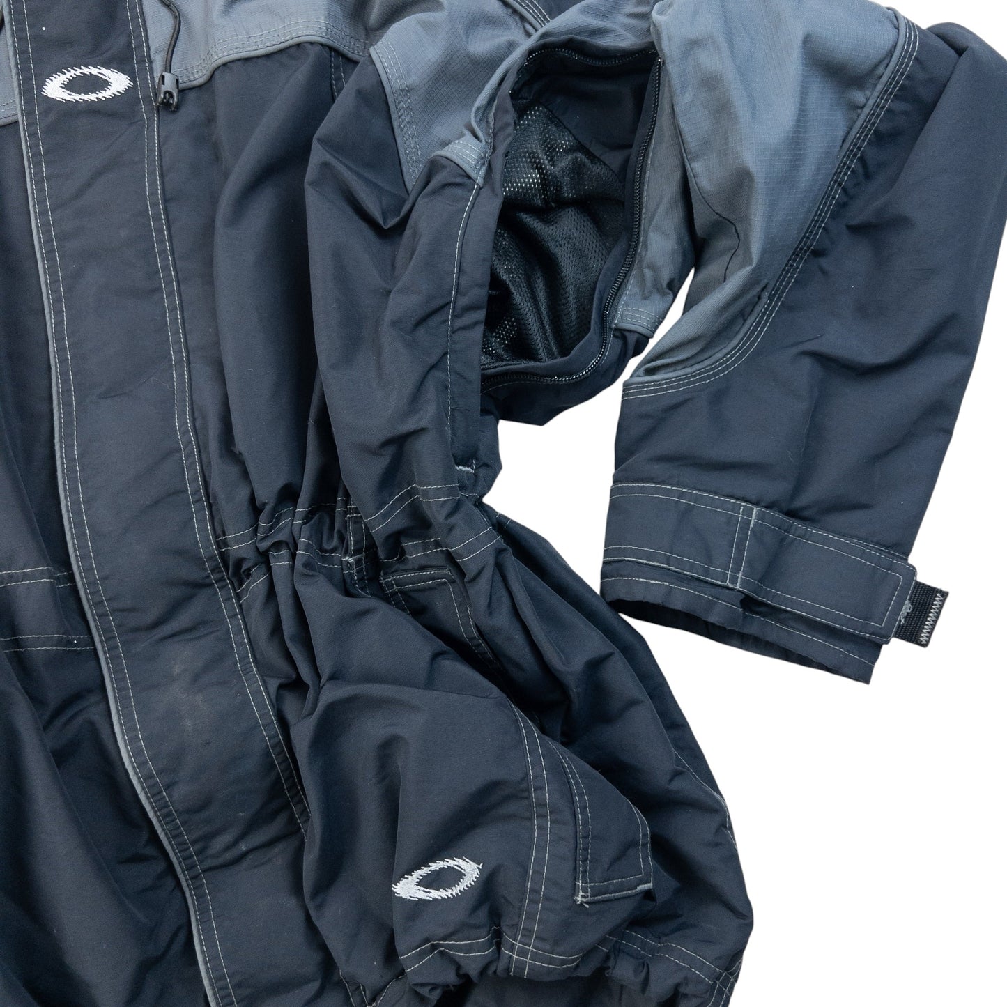 OAKLEY black and grey zip-up snowboarding jacket with embroidered logo and adjustable cuffs.