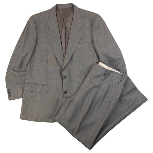 BALENCIAGA grey checkered suit set featuring a two-button jacket with flap pockets and pleated trousers