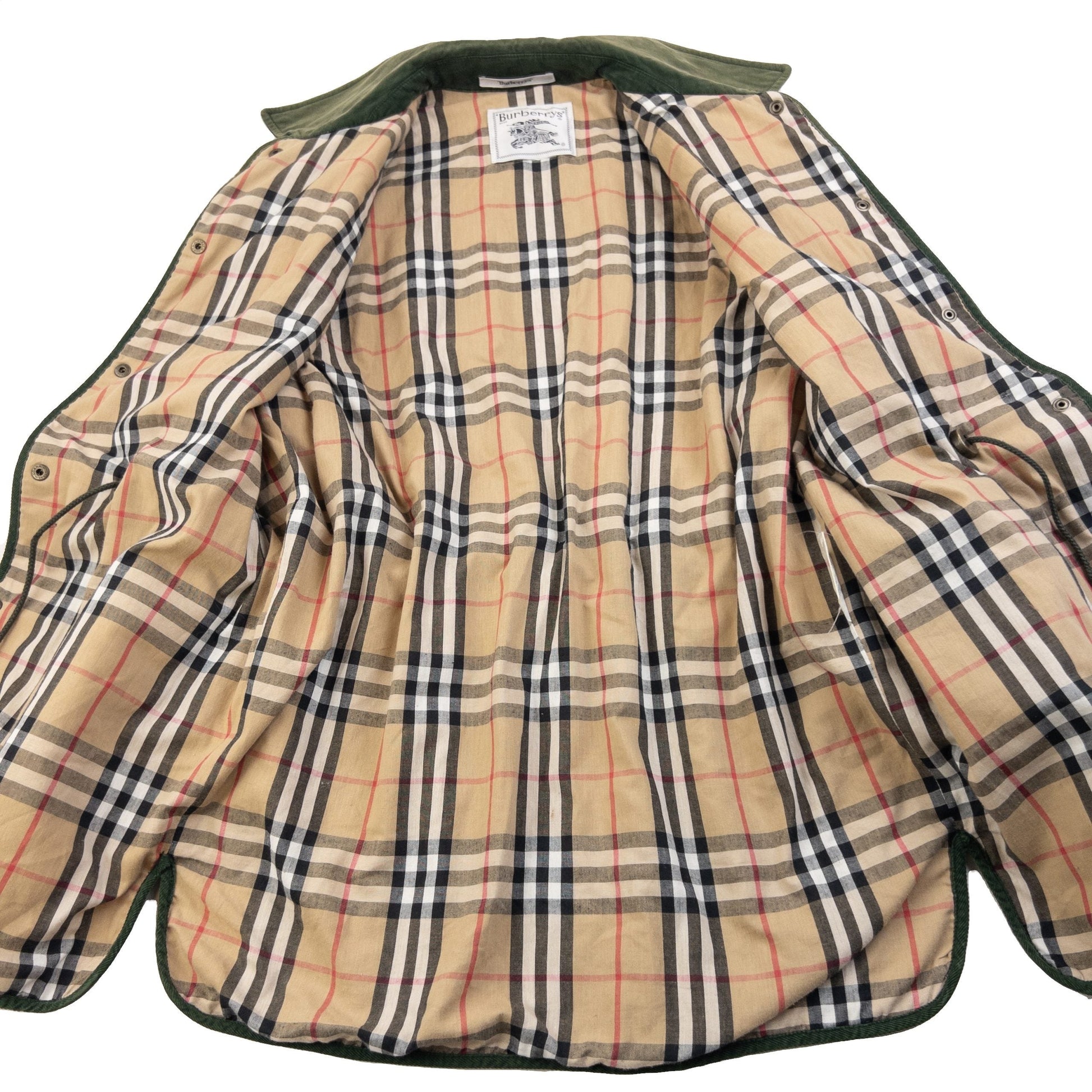 Burberry green quilted jacket with Nova Check lining, snap button closure, and corduroy collar.
