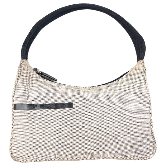 Prada beige and black shoulder bag zip top closure and logo plaque detail inside.
