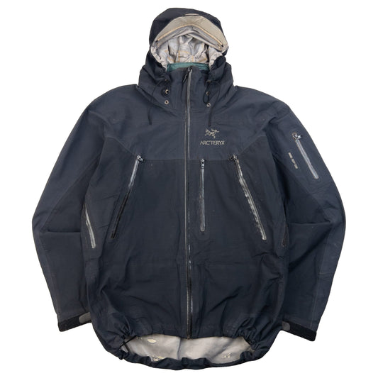 ARCTERYX black jacket featuring adjustable hood, multiple zip pockets, and hook and loop cuffs.