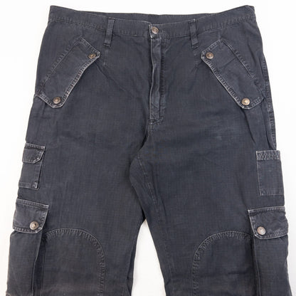 DOLCE & GABBANA black cargo trousers with multiple flap pockets and reinforced knee patches.