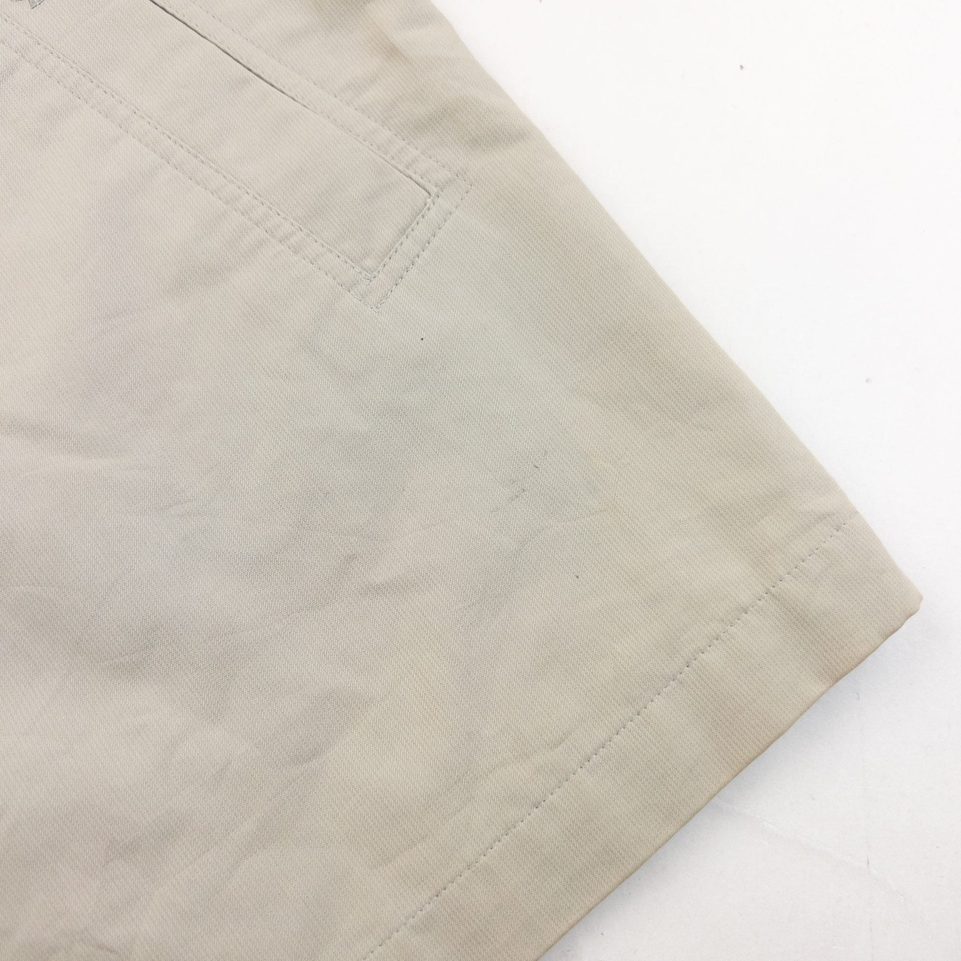YVES SAINT LAURENT beige Harrington jacket with YSL embroidery on pocket and checkered lining.