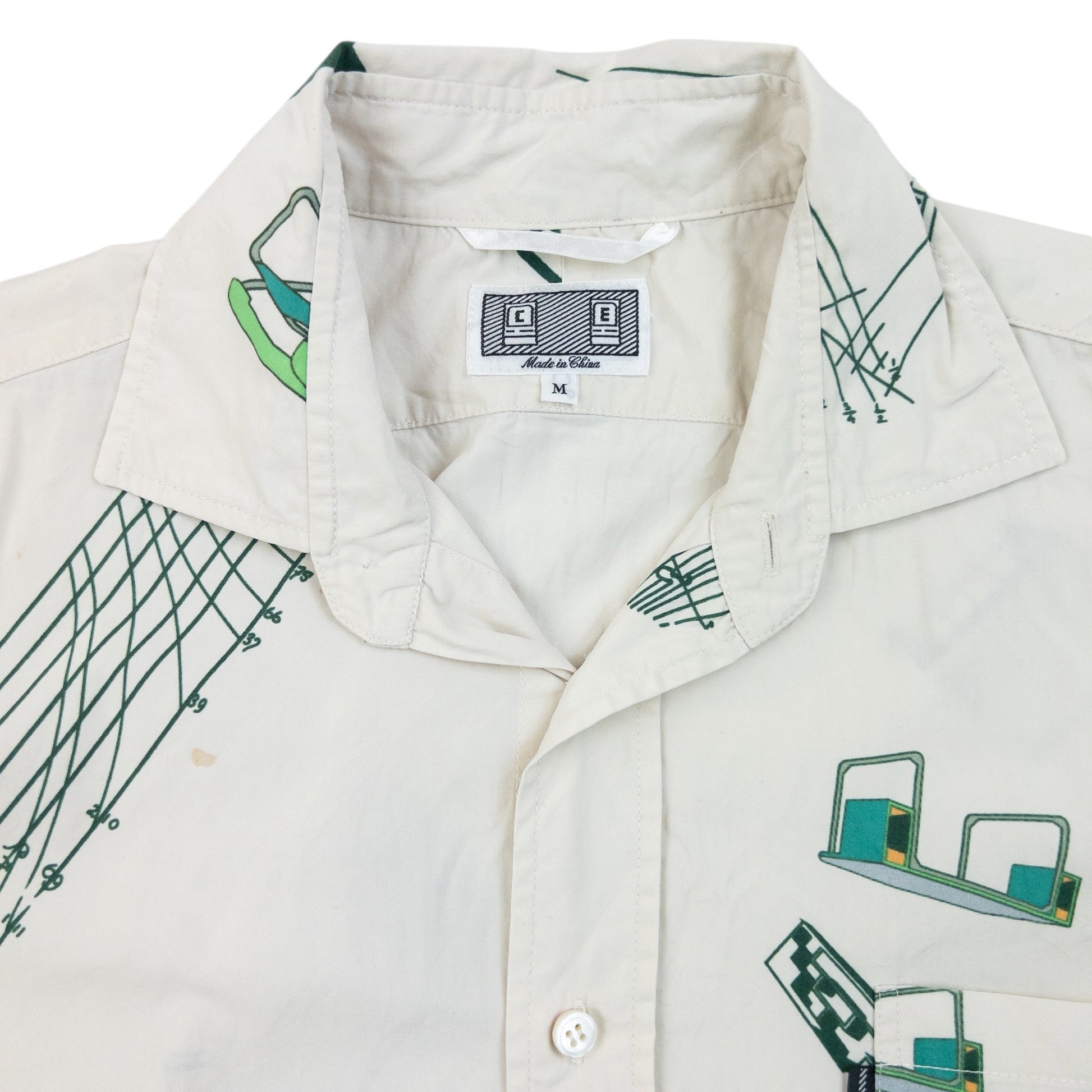 Cav Empt blue and white button-up shirt with abstract geometric print and single chest pocket.