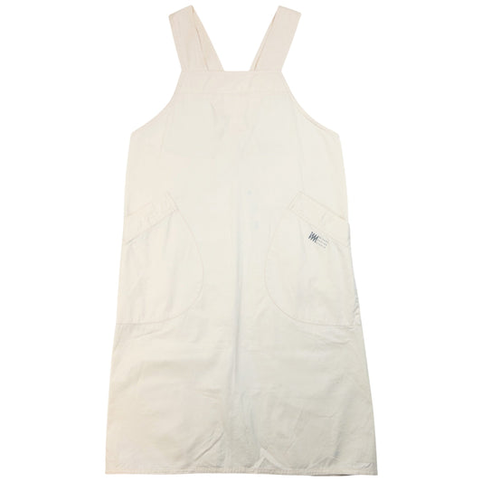 ISSEY MIYAKE beige apron with crossed back straps and stamped logo pocket detail
