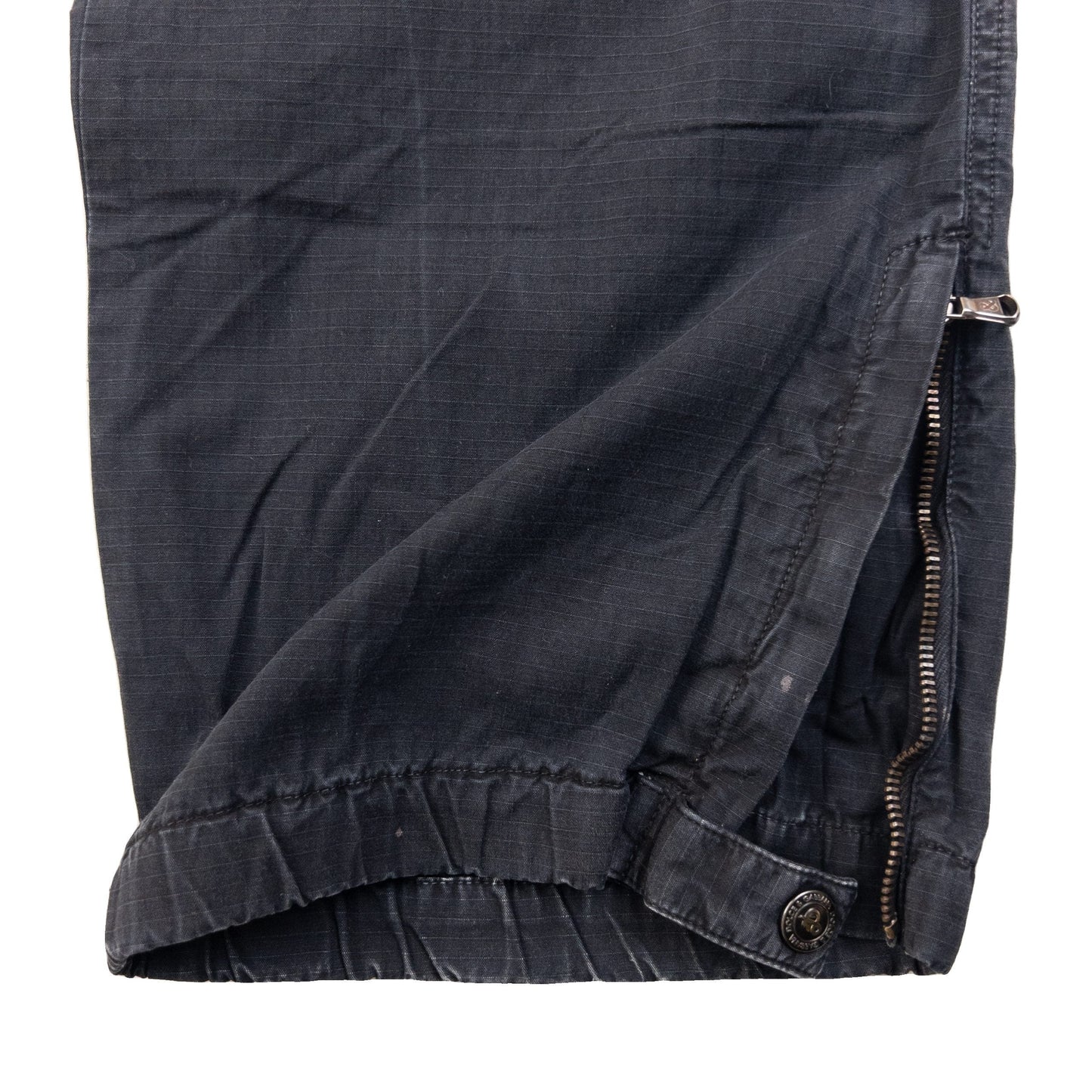 DOLCE & GABBANA black cargo trousers with multiple flap pockets and reinforced knee patches.