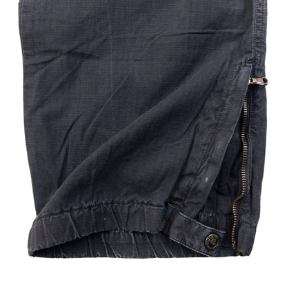 DOLCE & GABBANA black cargo trousers with multiple flap pockets and reinforced knee patches.