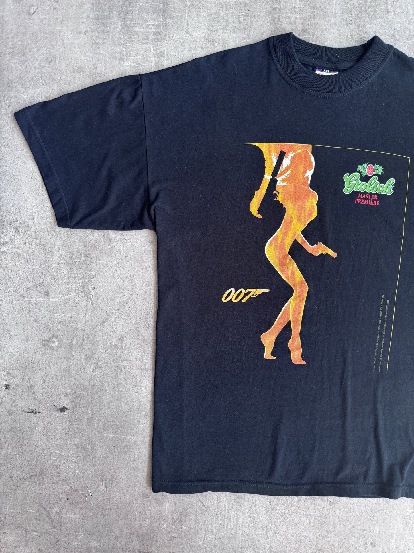 1999 James Bond " The World Isz Not Enough" Grolsch Premier Graphic Tee | Extra Extra Large, Multicoloured