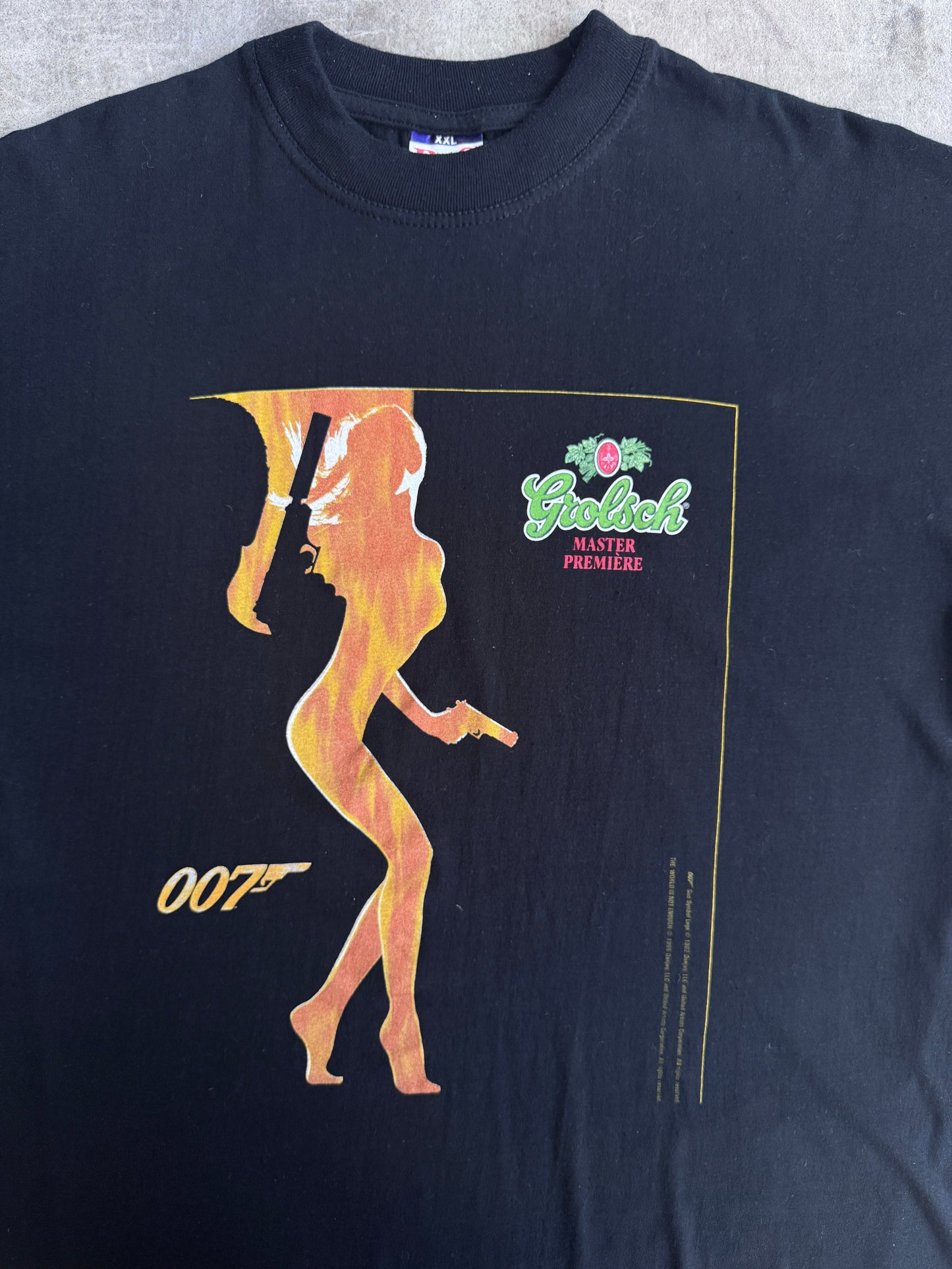 1999 James Bond " The World Isz Not Enough" Grolsch Premier Graphic Tee | Extra Extra Large, Multicoloured