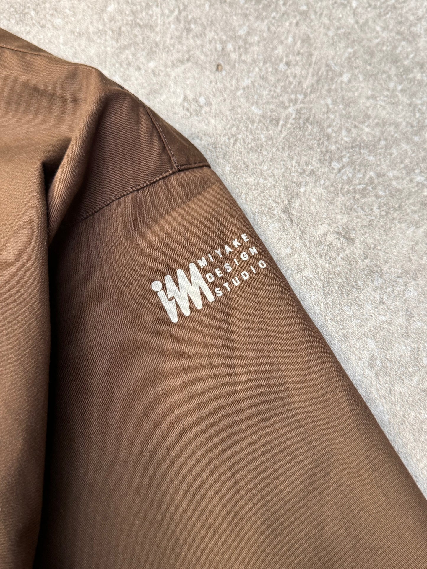 Issey Miyake Oversized Printed Logo Brown Mid-Length Jacket