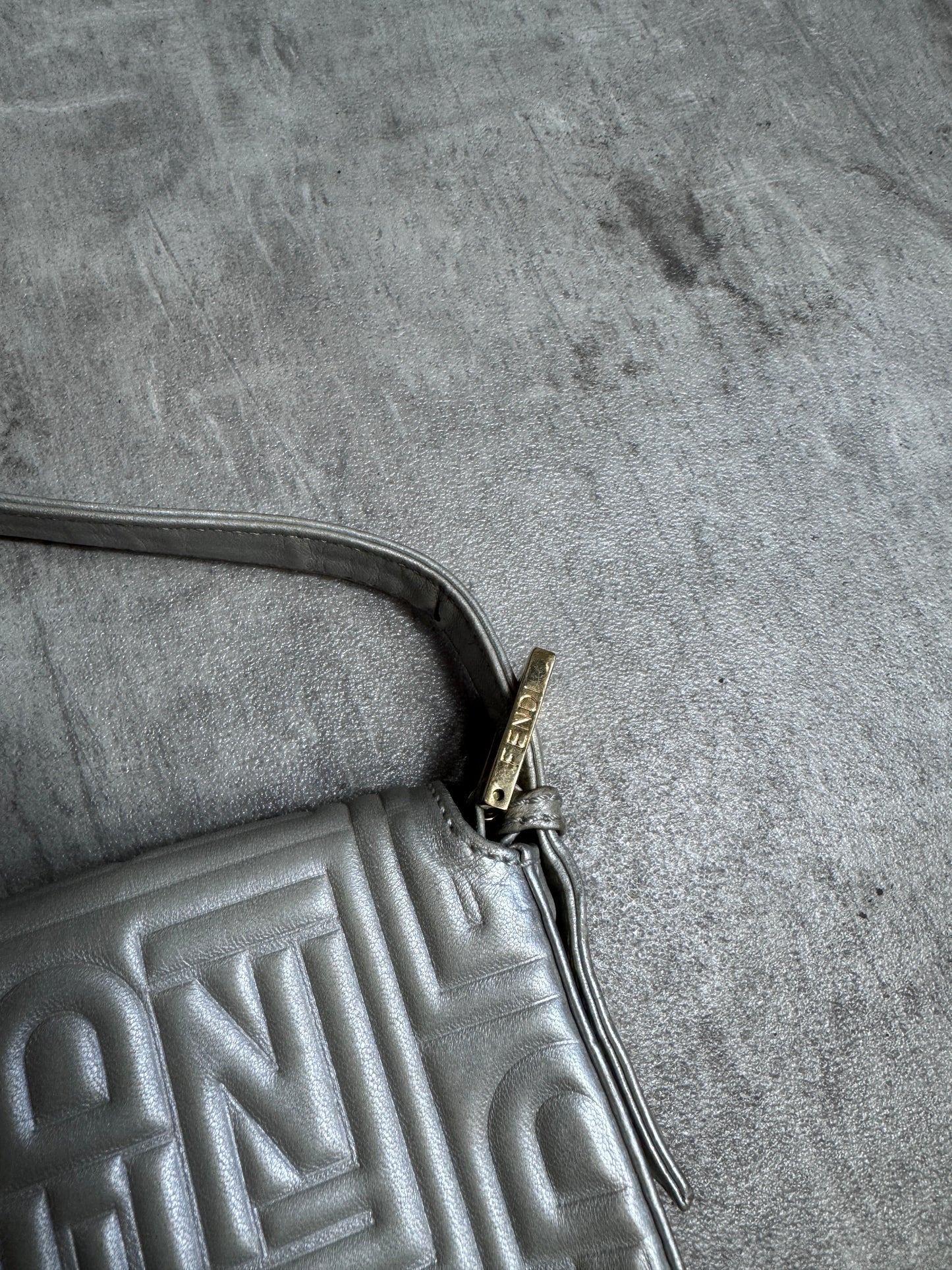 Fendi Logo Embossed Nappa Leather Silver Baguette Bag
