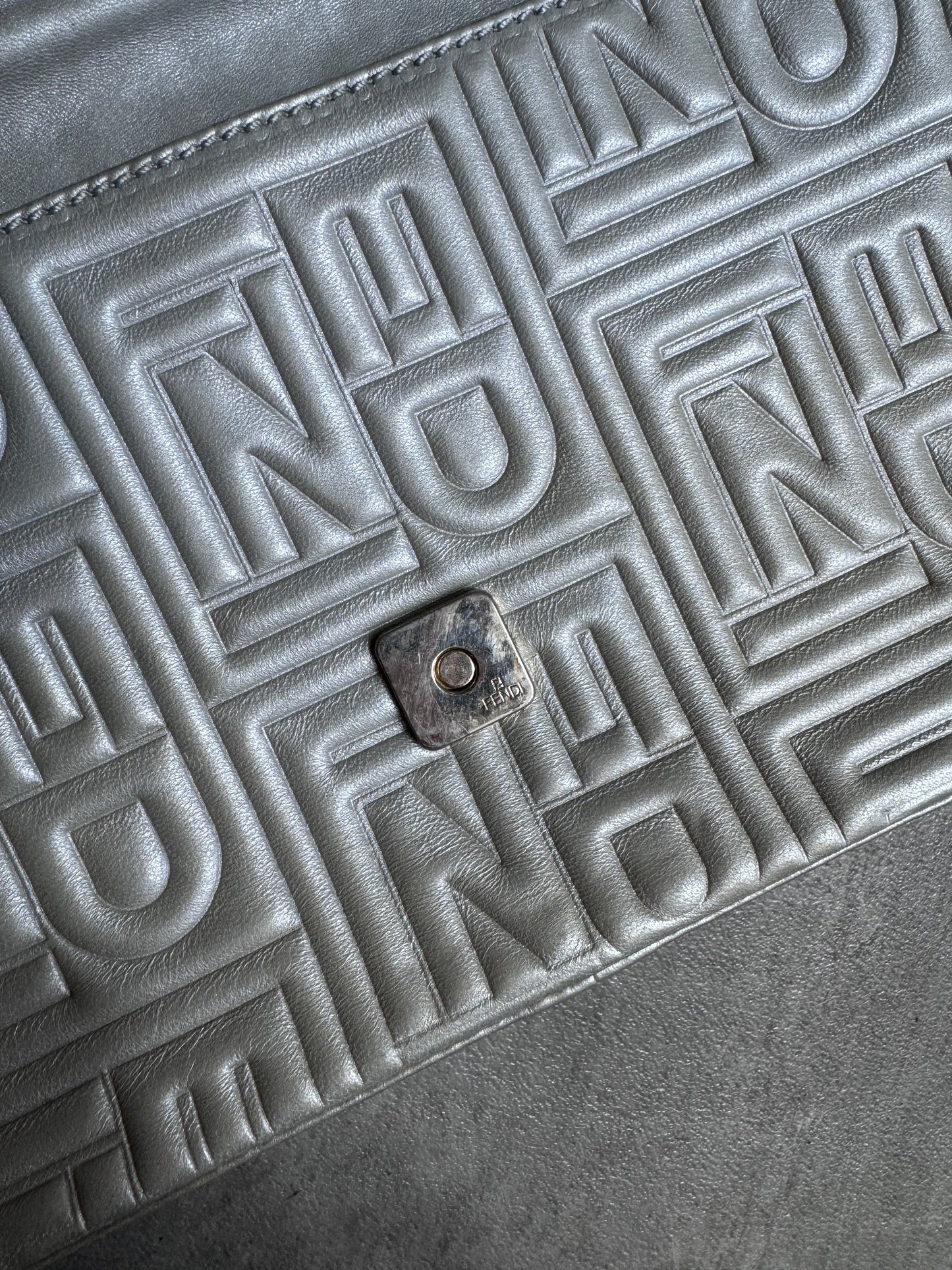 Fendi Logo Embossed Nappa Leather Silver Baguette Bag