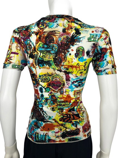 Colorful graphic t-shirt on a mannequin against a plain background