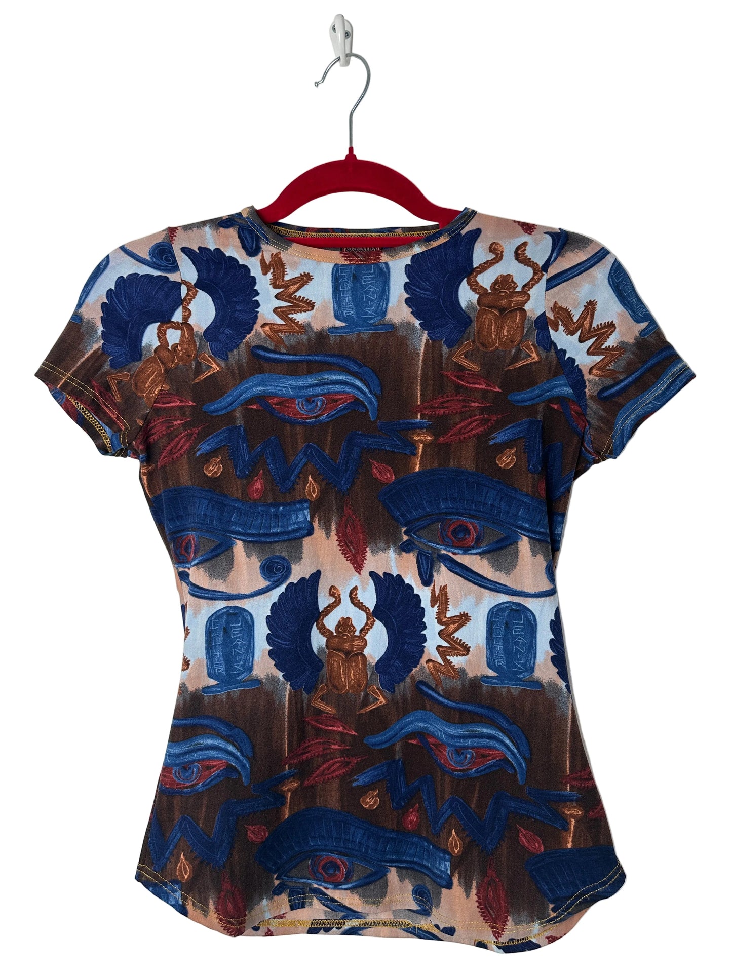 https://cdn.shopify.com/s/files/1/0900/2729/5066/files/Jean_Paul_Gaultier_Egypt_Print_Top_Hanger.jpg?v=1771605373