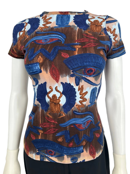 https://cdn.shopify.com/s/files/1/0900/2729/5066/files/Jean_Paul_Gaultier_Egypt_Print_Top.jpg?v=1771605137