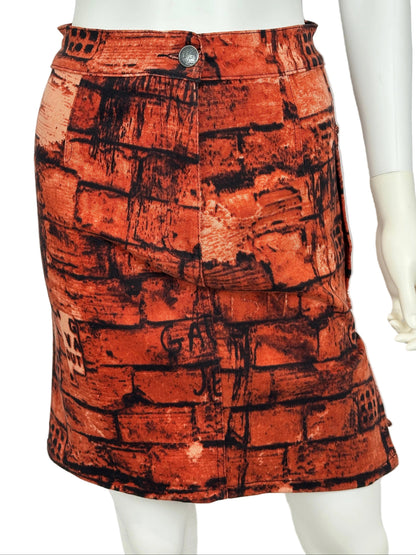 https://cdn.shopify.com/s/files/1/0900/2729/5066/files/Jean_Paul_Gaultier_FW_1997_Fight_Racism_Skirt.jpg?v=1774458279