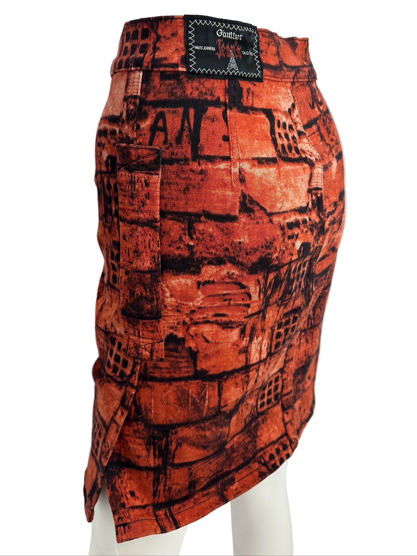 https://cdn.shopify.com/s/files/1/0900/2729/5066/files/Jean_Paul_Gaultier_FW_1997_Fight_Racism_Skirt_Side_Detail.jpg?v=1774458529