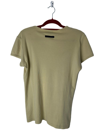 Beige t-shirt on a hanger against a white background