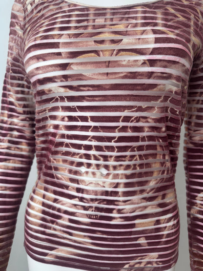 Close up of a red striped top with demon print