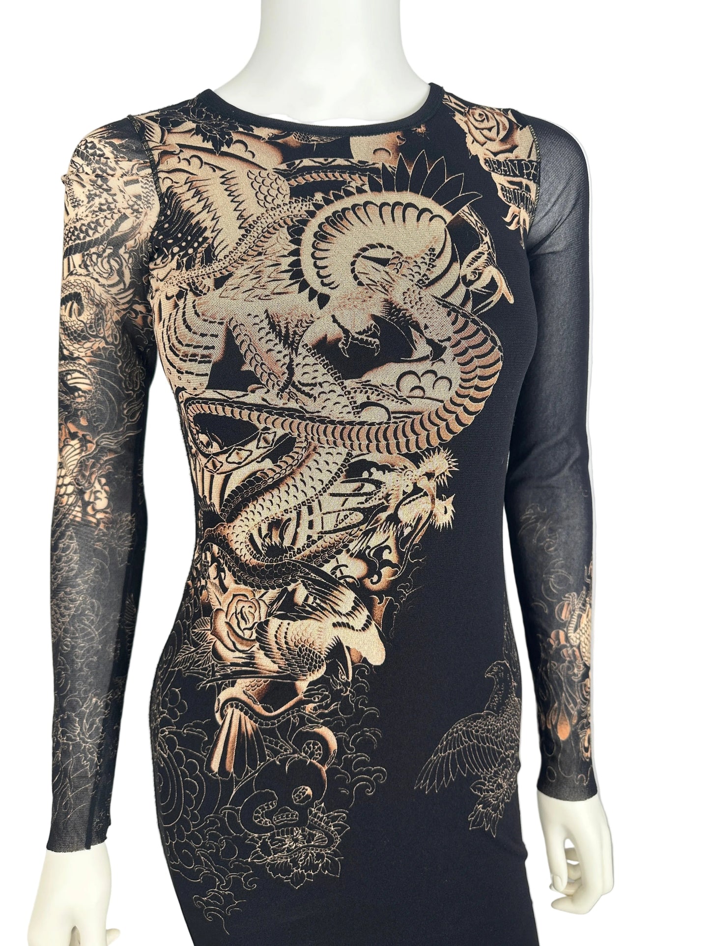 https://cdn.shopify.com/s/files/1/0900/2729/5066/files/Jean_Paul_Gaultier_Soleil_Tattoo_Dragon_Dress_Close_Up_Front.jpg?v=1774384029