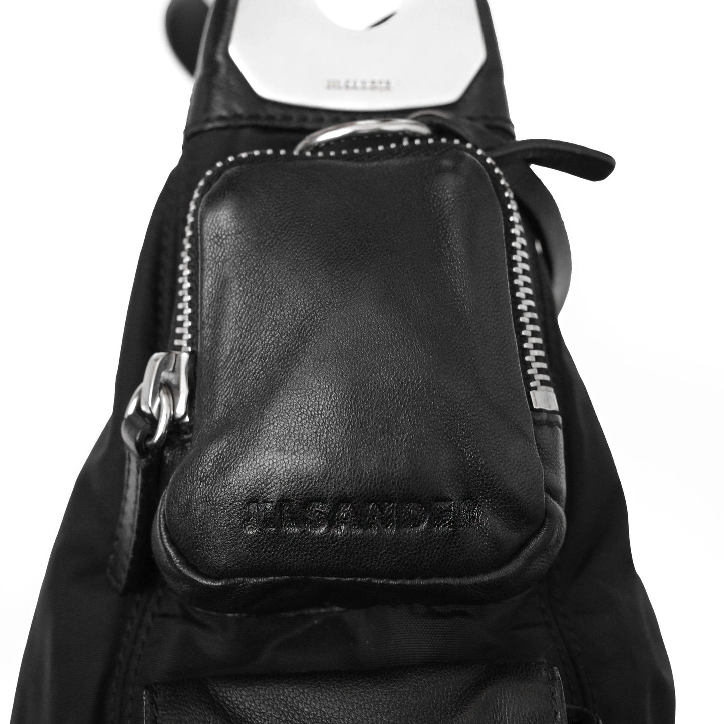 https://images.squarespace-cdn.com/content/v1/673cad159307f210013ba2f7/c1464143-4bc5-4328-9210-bbbb60ba74ba/JilSander_Spring2003_NylonLeatherCargoPocketBag_7.jpg