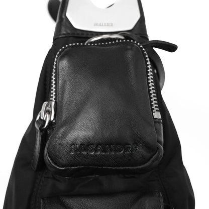 https://images.squarespace-cdn.com/content/v1/673cad159307f210013ba2f7/c1464143-4bc5-4328-9210-bbbb60ba74ba/JilSander_Spring2003_NylonLeatherCargoPocketBag_7.jpg