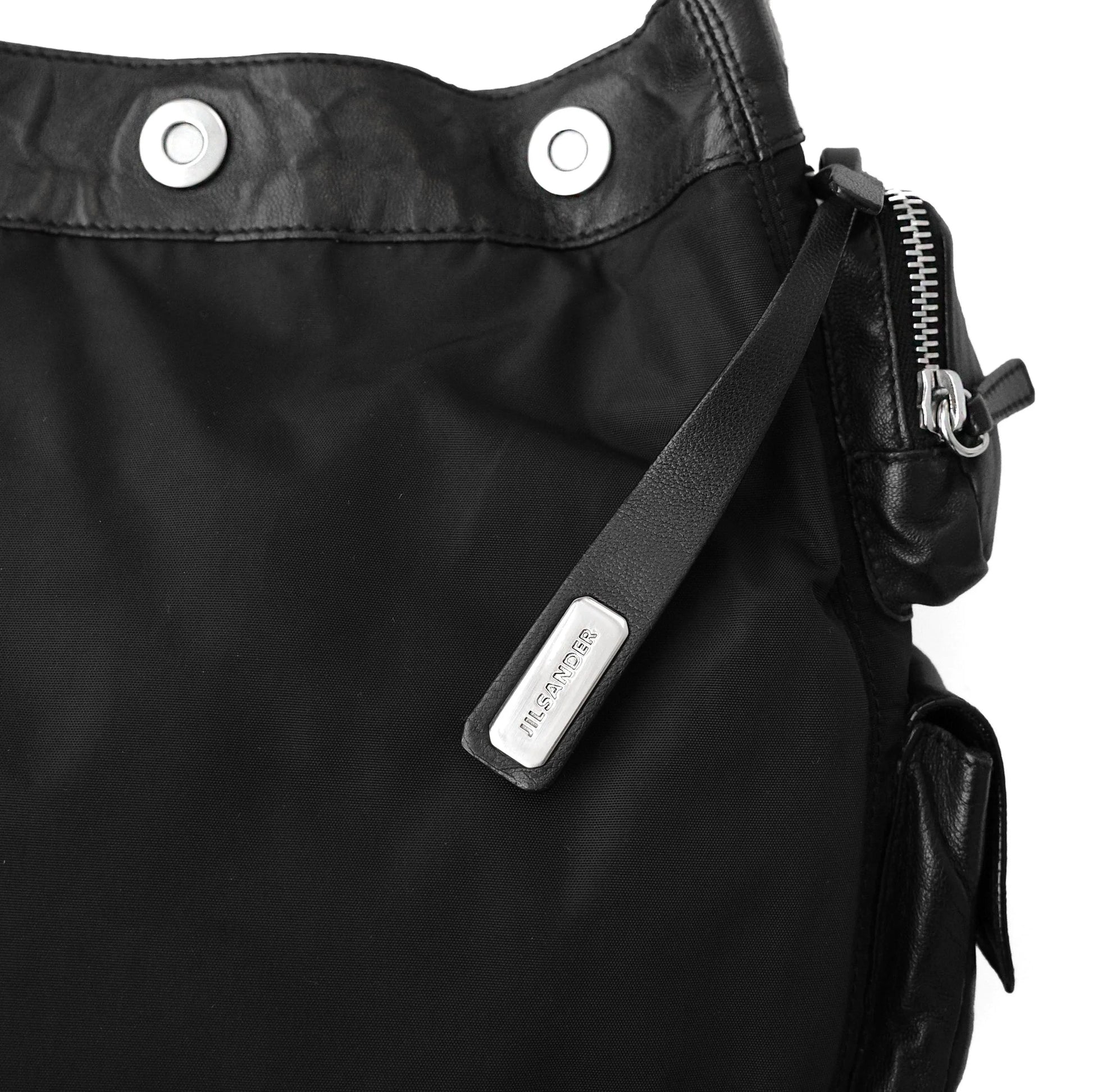 https://images.squarespace-cdn.com/content/v1/673cad159307f210013ba2f7/fe0520ad-53a9-44f5-a324-9254dc47118c/JilSander_Spring2003_NylonLeatherCargoPocketBag_9.jpg