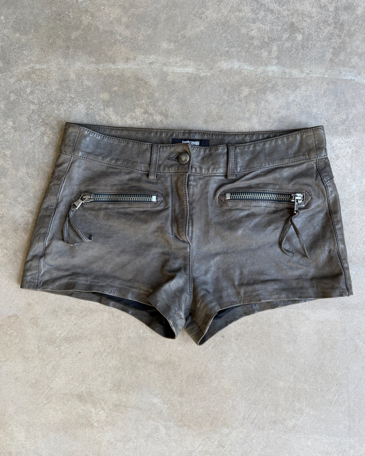 Just Cavalli Brown Leather Mini Shorts – S-on a concrete background