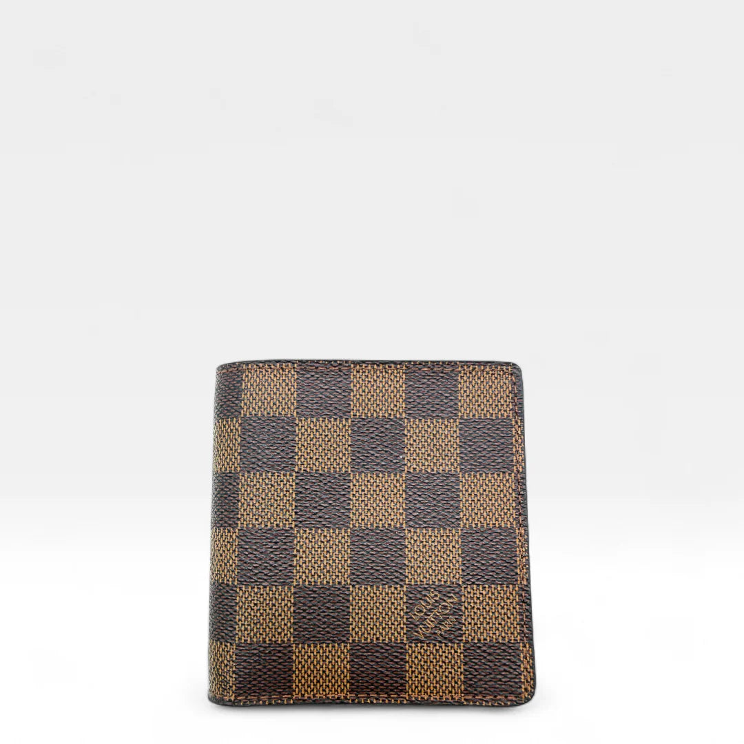 https://cdn.shopify.com/s/files/1/0564/9376/8855/files/Louis_Vuitton_Geldbeutel_Damier_Ebene_braun_vintage_LV_wallet1284.webp?v=1762427142