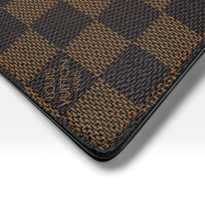 https://cdn.shopify.com/s/files/1/0564/9376/8855/files/Louis_Vuitton_Geldbeutel_Damier_Ebene_braun_vintage_LV_wallet1294.webp?v=1762427142