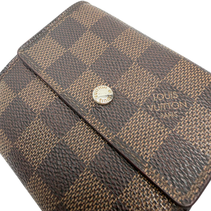 https://cdn.shopify.com/s/files/1/0564/9376/8855/files/Louis_Vuitton_Geldbeutel_Elise_Damier_Ebene_braun_vintage_LV_0199.webp?v=1771411630