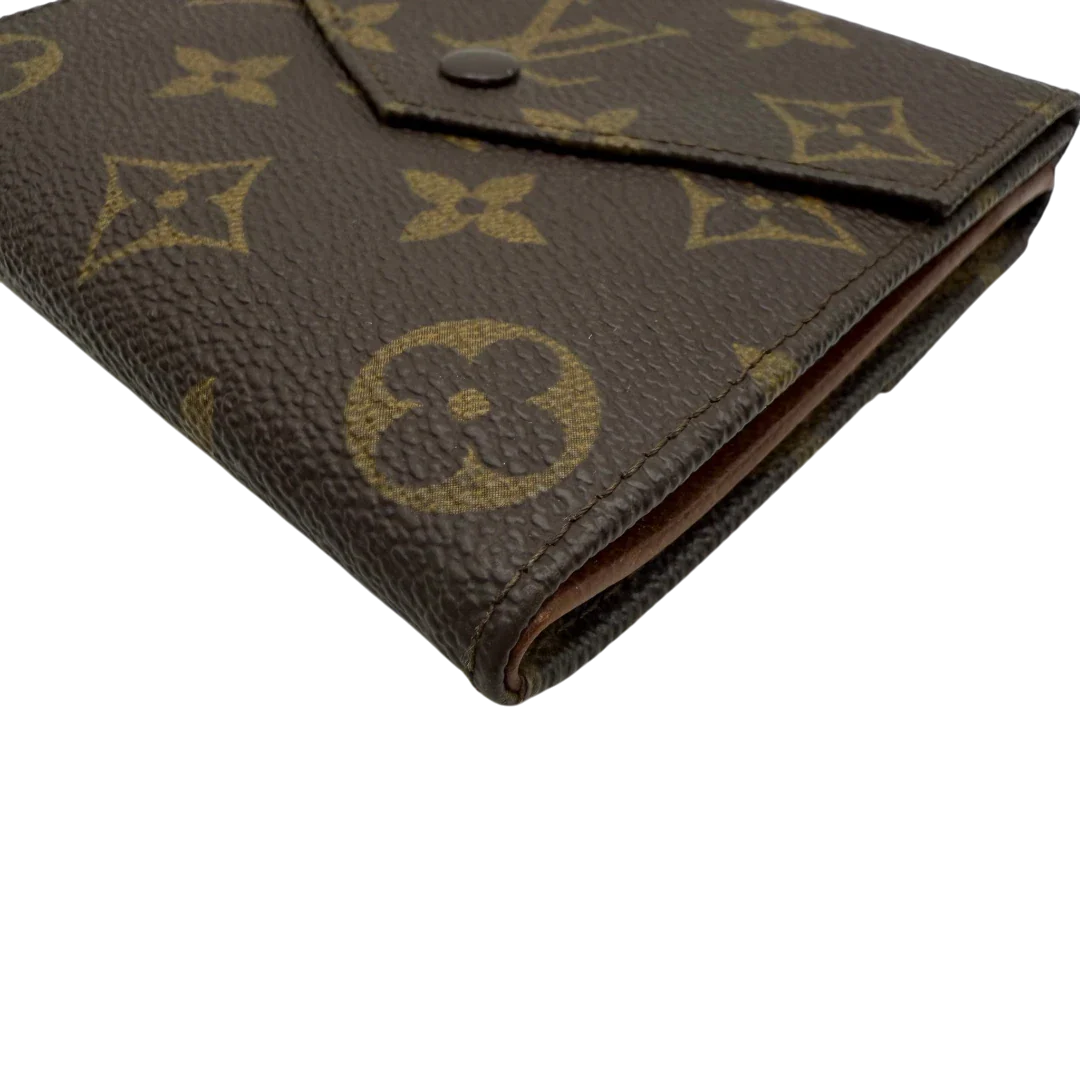 https://cdn.shopify.com/s/files/1/0564/9376/8855/files/Louis_Vuitton_Geldbeutel_Elise_monogram_braun_vintage_LV4034.webp?v=1775734643