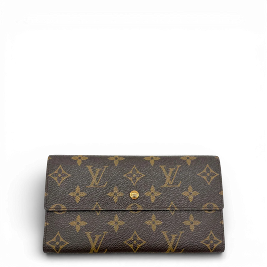 https://cdn.shopify.com/s/files/1/0564/9376/8855/files/Louis_Vuitton_Geldbeutel_International_monogram_braun_LV2381.webp?v=1773325141