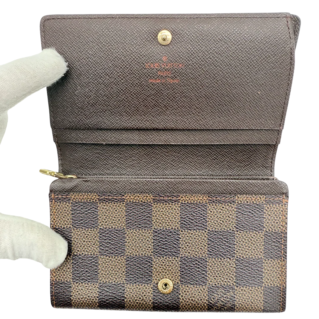 https://cdn.shopify.com/s/files/1/0564/9376/8855/files/Louis_Vuitton_Geldbeutel_Porte_Monnaie_Tresor_Damier_Ebene_braun_vintage_LV_1367.webp?v=1771414022