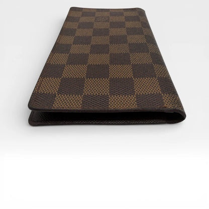 https://cdn.shopify.com/s/files/1/0564/9376/8855/files/Louis_Vuitton_Geldbeutel_Portefeuille_Damier_Ebene_braun_vintage_LV_8673.webp?v=1769075831