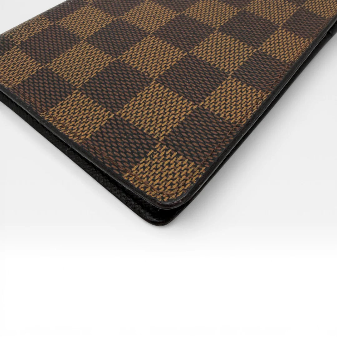 https://cdn.shopify.com/s/files/1/0564/9376/8855/files/Louis_Vuitton_Geldbeutel_Portefeuille_Damier_Ebene_braun_vintage_LV_8678.webp?v=1769075832