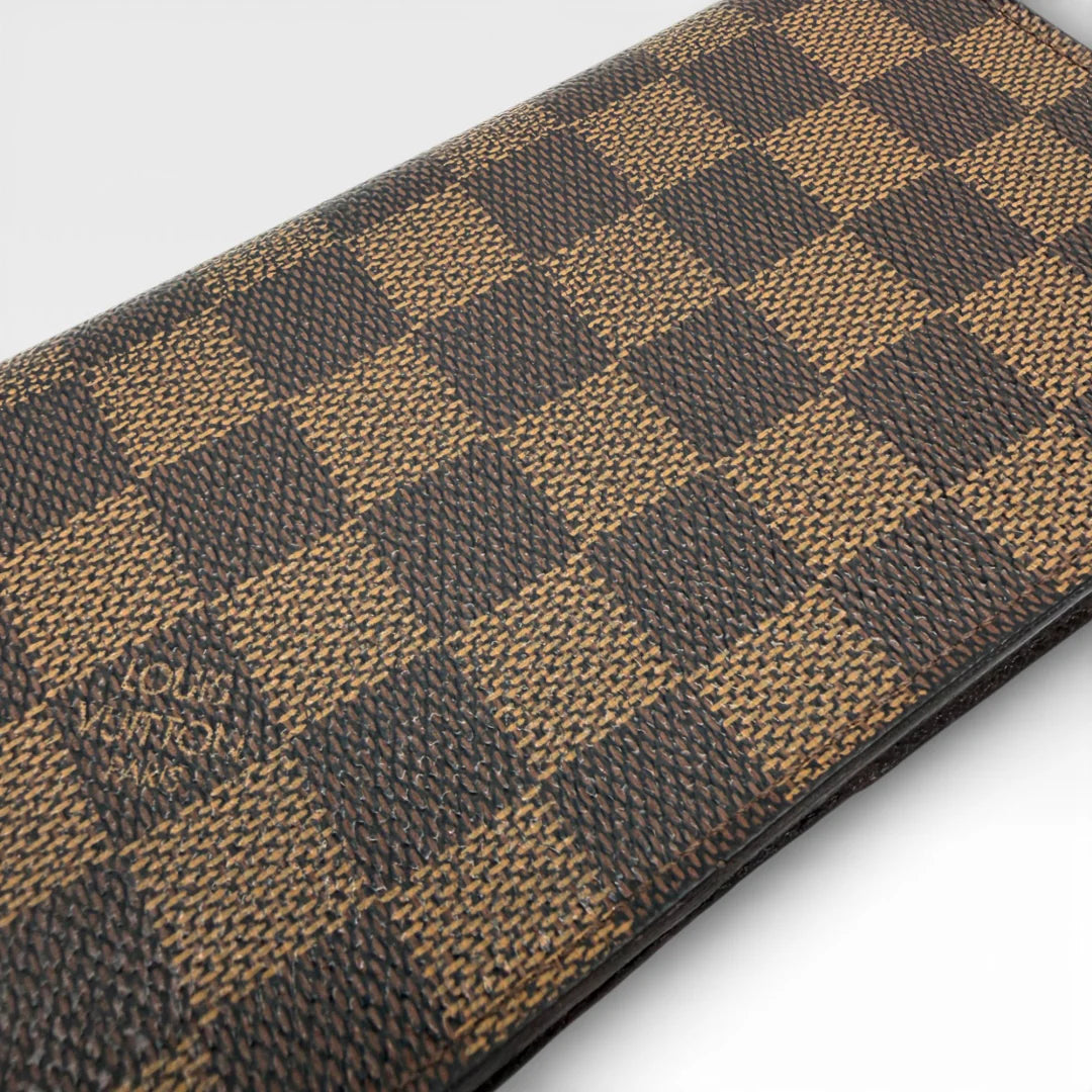 https://cdn.shopify.com/s/files/1/0564/9376/8855/files/Louis_Vuitton_Geldbeutel_Portefeuille_Damier_Ebene_braun_vintage_LV_8681.webp?v=1769075832