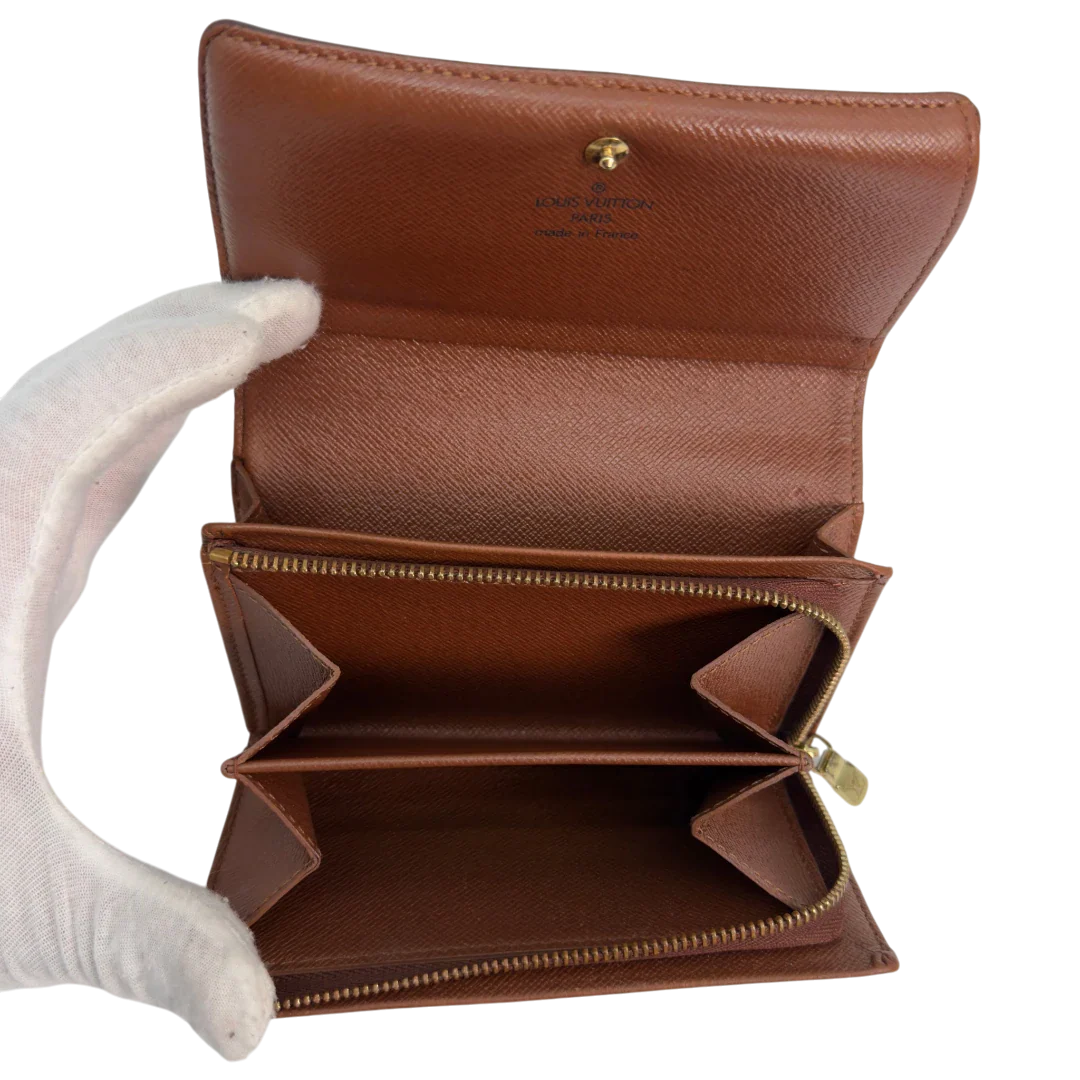 https://cdn.shopify.com/s/files/1/0564/9376/8855/files/Louis_Vuitton_Geldbeutel_Portefeuille_International_monogram_braun_vintage_LV8641.webp?v=1781084066