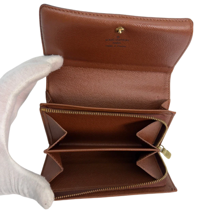 https://cdn.shopify.com/s/files/1/0564/9376/8855/files/Louis_Vuitton_Geldbeutel_Portefeuille_International_monogram_braun_vintage_LV8641.webp?v=1781084066
