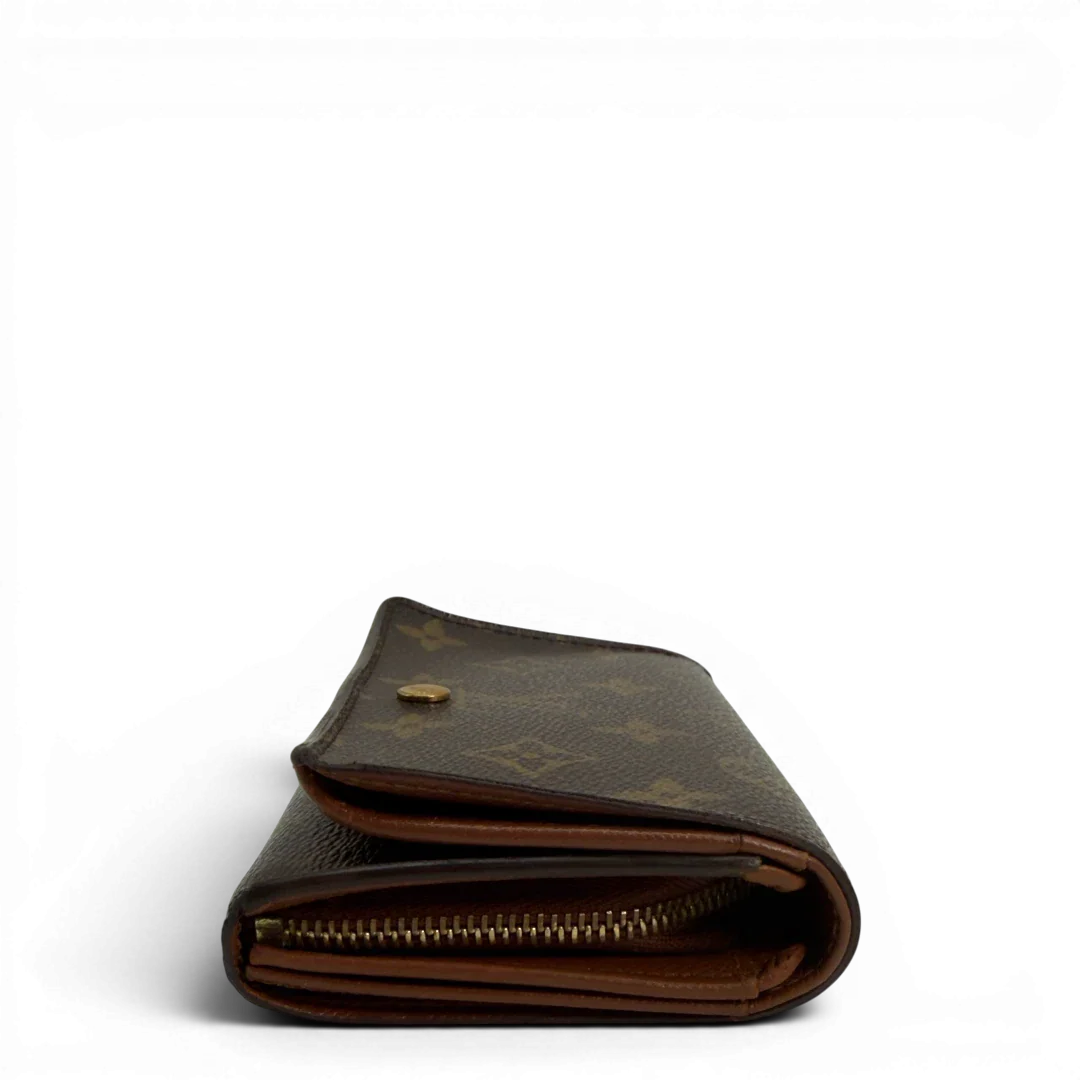 https://cdn.shopify.com/s/files/1/0564/9376/8855/files/Louis_Vuitton_Geldbeutel_Portefeuille_International_monogram_braun_vintage_LV8644.webp?v=1781084065