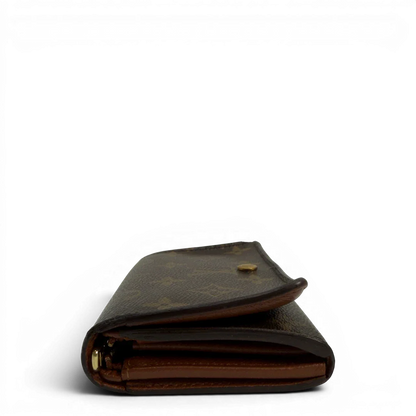 https://cdn.shopify.com/s/files/1/0564/9376/8855/files/Louis_Vuitton_Geldbeutel_Portefeuille_International_monogram_braun_vintage_LV8645.webp?v=1781084065